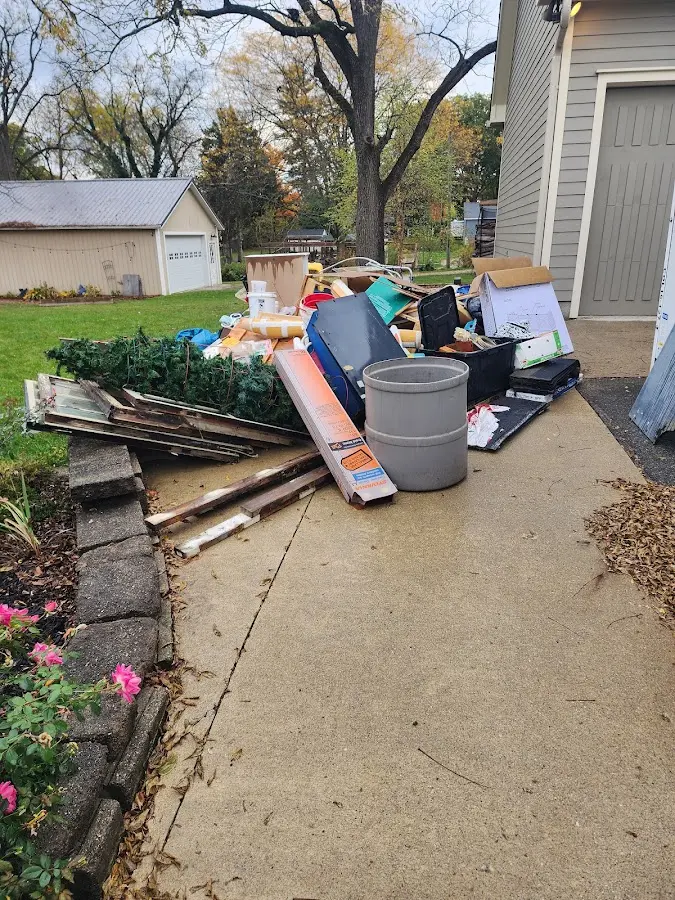 Dumpster being loaded with debris for 10 Yard Dumpster Rental in Callaway